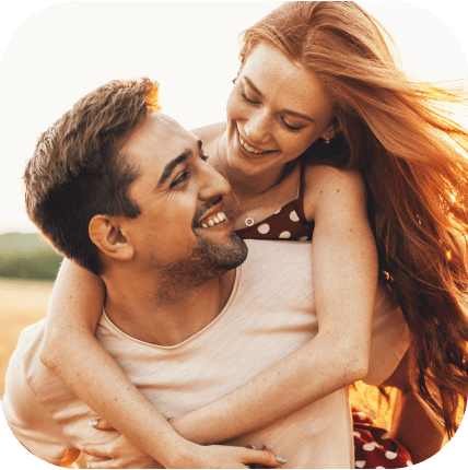 Two people enjoying a quick match on Mixu, smiling and embracing each other